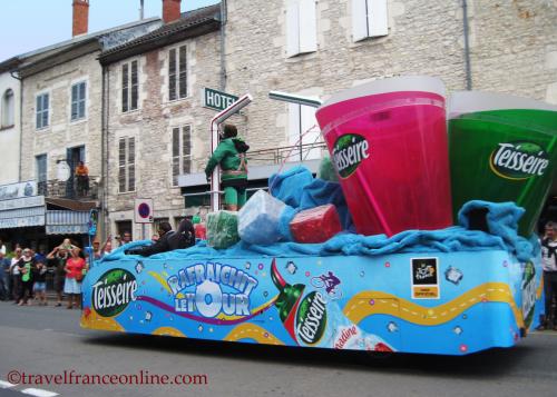 Caravane du Tour de France: Sponsors parading and throwing gadgets and mini gifts to the crowds